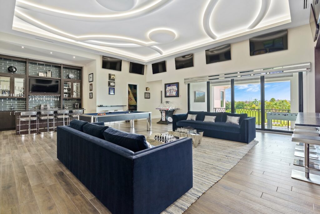Game room with pool table and bar in an Orlando vacation rental