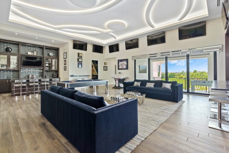Game room with pool table and bar in an Orlando vacation rental