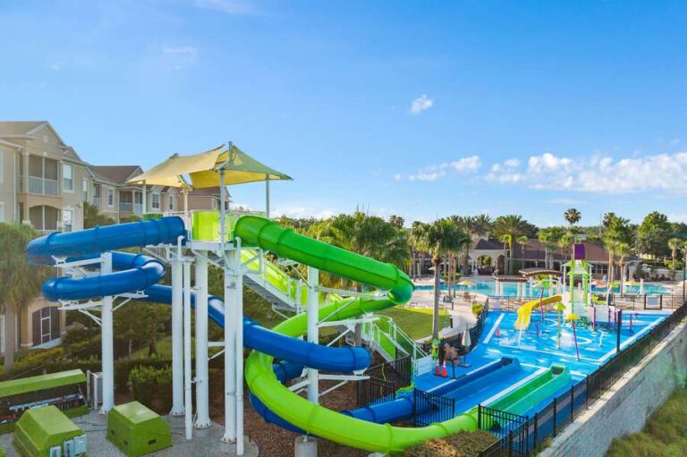 Water slides and splash pad at a resort community pool near Disney